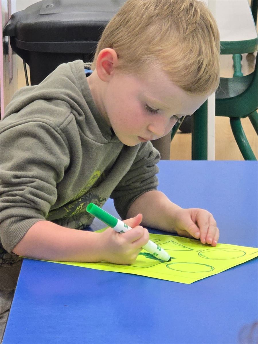 Little Diamonds student drawing with a marker